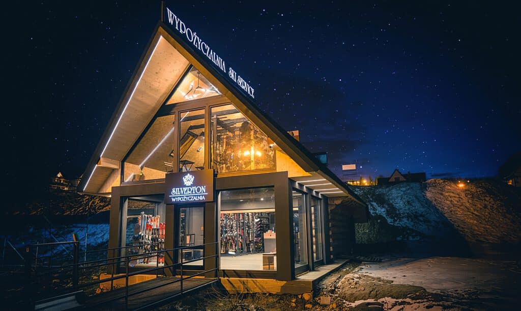 The illuminated entrance to Silverton guest house at night