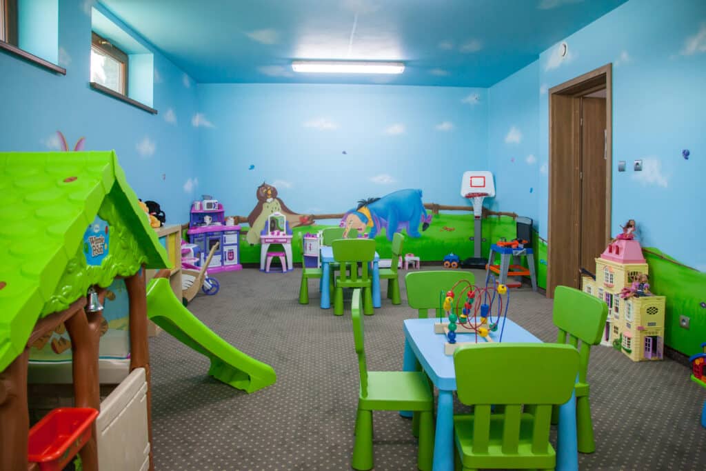 A playhouse with a slide in the playroom