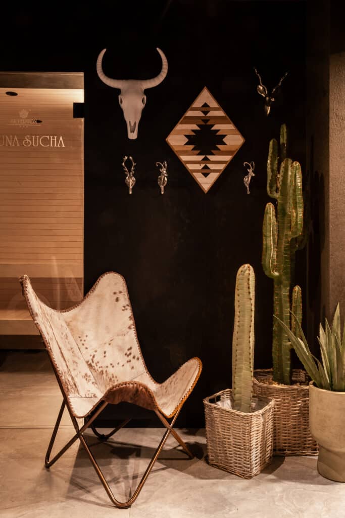 An armchair and wooden wall decorations in a cosy Silverton interior