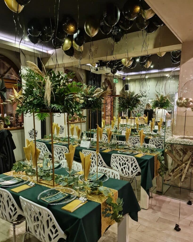 Silverton dining room with gold and black balloons and tables laid for dinner