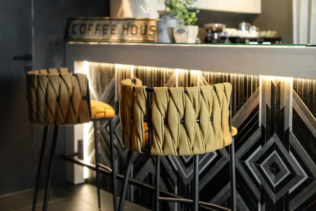 Armchairs and the illuminated bar counter