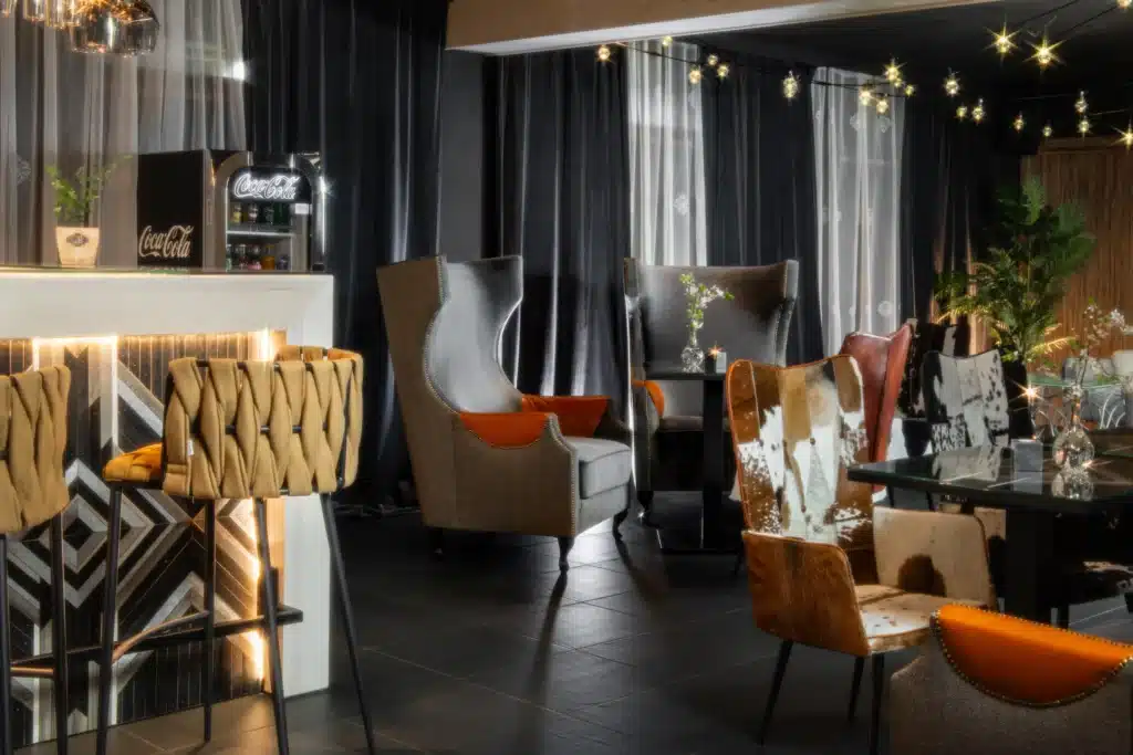 The Silverton bar with an illuminated counter, armchairs and tables