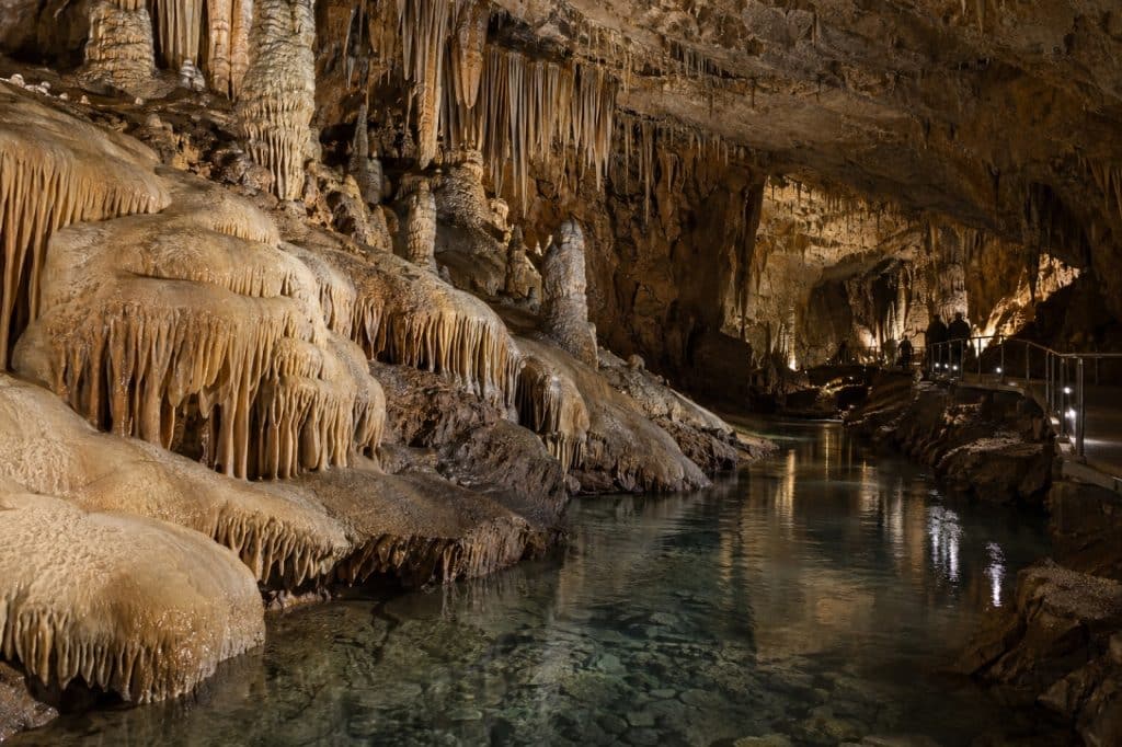 Limestone formations and underground water inside a large show cave